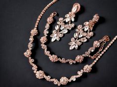 "Your special day deserves the perfect bridal jewelry set to complement your beautiful wedding gown. Whether you prefer the romantic allure of rose gold or the classic elegance of silver, there is a stunning chandelier earrings necklace bracelet waiting for you. Imagine the sparkle and shine of these exquisite pieces as you walk down the aisle, feeling confident and radiant. Plus, don't forget your beloved bridesmaids who also deserve to shine with a matching jewelry set. With exquisite attentio Elegant Rose Gold Jewelry Set For Party, Rose Gold Jewelry Sets With Elegant Design For Party, Elegant Rose Gold Bridal Necklace For Party, Glamorous Rose Gold Jewelry For Wedding, Glamorous Rose Gold Wedding Jewelry, Rose Gold Bridal Necklace For Party, Elegant Rose Gold Jewelry For Mother Of The Bride, Delicate Rose Gold Bridal Necklace For Party, Hand Set Rose Gold Jewelry Sets For Wedding