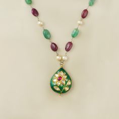 Gold(22K) : 4.17gGold(14K) : 2.50gUncut Diamond/Vilandi/Polki: 0.76ctGemstones : Emerald, Ruby, Cultured Pearls925 SilverOther : Green Enamel, Red Enamel and White Enamel Temple Jewelry Style Emerald Gemstone Necklace As Gift, Temple Style Emerald Gemstone Necklace As Gift, Emerald Necklace For Gift In Temple Jewelry Style, Emerald Gemstone Necklace For Gift, Temple Jewelry Style, Traditional Yellow Gold Multi-stone Necklace, Traditional Emerald Gemstone Necklace Gift, Kundan Emerald Gemstone Necklace As A Gift, Kundan Emerald Necklace As Gift, Gift Kundan Emerald Necklace