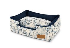 the blue and white dog bed is made out of fabric