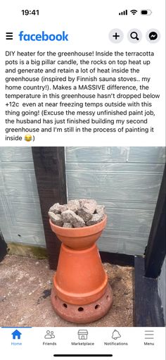 an orange pot with rocks in it sitting on the ground