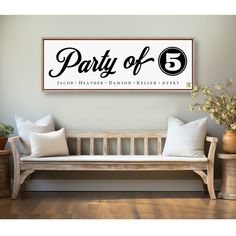 a wooden bench sitting in front of a wall with a sign that says party of 5