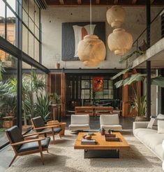 a living room filled with lots of furniture and plants on top of carpeted flooring