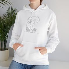 This minimalistic baby elephant line art hoodie exudes a cute and cozy vibe, perfect for casual outings or lounging at home. Ideal for animal lovers and those who appreciate simple yet stylish designs. Great for gifting on birthdays, anniversaries, or just to show someone you care. Product features - Spacious kangaroo pouch pocket for keeping hands warm - Adjustable drawstring hood for added comfort - Seamless construction for a more attractive design - Made from 50% cotton and 50% polyester for strength and smoothness - Ethically grown US cotton ensures sustainability and quality Care instructions - Tumble dry: medium - Iron, steam or dry: low heat - Do not dryclean - Machine wash: cold (max 30C or 90F) - Non-chlorine: bleach as needed Dog With Glasses, Floral Hoodie, Astrology Zodiac, Cozy Sweatshirts, Hand Warmers, Custom Fit, Hoodie Sweatshirt, Pocket Pouch, Unisex Hoodies