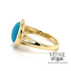 The combination of yellow gold and turquoise, though not seen as often as other metals, offers a striking contrast. The round cabachon fine turquoise in this estate ring is often referred to as "robin's egg" blue with almost no secondary coloration, and is usually considered the most desirable color. It is bezel set in a polished 18 karat yellow gold setting with triangular gold buttresses incorporated into the shoulder design, tapering down to a 2.5 mm shank. The ring is size 5.5. Gold Turquoise Cabochon Ring In 14k Gold, Classic Yellow Gold Turquoise Ring, Anniversary Turquoise Cabochon Ring In Yellow Gold, Gold Turquoise Oval Cabochon Ring, Classic Yellow Gold Turquoise Cabochon Ring, Classic Cabochon Turquoise Ring In Yellow Gold, Classic Gold Turquoise Ring With Round Shape, 14k Yellow Gold Turquoise Cabochon Ring, Anniversary Yellow Gold Turquoise Ring With Oval Cabochon