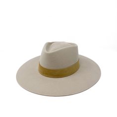 Our new style the Sydney is a stockman stiff felt in a beautiful bone antique white wrapped with dusty camel tonal suede. It has an angled crown - a new shape for us! The Sydney fedora has no stretch or movement so please size accordingly. made in the U.S.A small 21-22 inch circ medium 22-23 inc circ large 23-24 inch circ Antique White, New Style, Jewelry Care, Fedora, Sydney, Camel, Felt, Crown, Leather