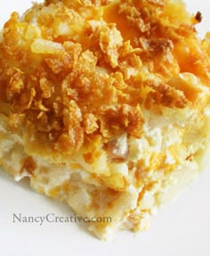 a close up view of some food on a white plate with crumbs all over it