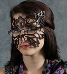 This very delicate mask was inspired by Art Nouveau designs. It portrays leaf veins, carefully cut out of lightweight vegetable tanned leather, and painted black. While it covers most of your face, it really hides nothing! Great for hot Summer festival wear. It comes with an adjustable elastic band. Lightweight and comfortable. The nose bridge is open so that you can wear glasses with it. Black Halloween Makeup, Leaf Mask, Mime Face Paint, Glasses Makeup, Venetian Masquerade, Costume Masks, Leather Mask, Art Nouveau Design, Masks Masquerade