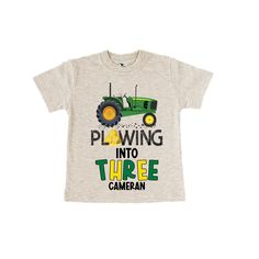 a toddler's t - shirt with a tractor on it that says, playing into two camera