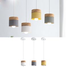 four different lights hanging from the ceiling and one is made out of wood, two are white