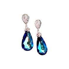 White gold plated metal bail with cubic zirconia deco and swarovski teardrop bermuda blue pendant crystal Large Swarovski 6100 Bermuda Blue precision faceted crystal teardrops  The Swarovski crystals measure 24 mm (1 inch) Tthe whole earrings including the Sterling Silver Ear post about 1.5 " (37mm) in total length This beautiful pair of Earrings is packaged in a gift box. Formal Teardrop Crystal Clip-on Earrings, Blue Pear-shaped Teardrop Earrings For Formal Occasions, Teardrop Crystal Clip-on Earrings For Formal Occasions, Teardrop Crystal Earrings With Diamond Accents Gift, Gift Teardrop Earrings With Diamond Accents, Formal Sparkling Pear-shaped Crystal Earrings, Formal Pear-shaped Crystal Earrings With Sparkling Stones, Formal Teardrop Crystal Earrings With Sparkling Stones, Sparkling Stone Teardrop Earrings