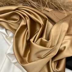 Gold satin silk fabric silk by the yard Gold satin fabric Pink Silk Satin fabric *Material: 20% silk, 75% polyester, and 5% elastane. *Width: 1.4 m = 55 in = 1.53 yards * Price for 1 meter/1.1 yards - 9.5$ *Soft Silk Satin Fabric of high quality can be used for dresses, skirts and bridal dresses. My clients are using this fabric for sewing for a long time and they are very satisfied with the quality. *Shipping company: USPS, DHL Express Worldwide. Please provide your phone number for a smooth an Party Silk Scarf With Satin Finish, Solid Color Satin Silk Scarf, Fabric Photography, Fabric For Sewing, Silk Satin Fabric, Gold Satin, Satin Silk, Fabric Silk, Pink Silk