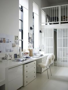 a white desk and chair in a room