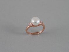 This beautiful CZ pearl ring features a 8-8.5 AAA genuine fresh water white pearl with high quality Rose gold plated triple cubic zirconia setting (nickel and lead free). These are tarnish resistant. Also available in White gold (silver colored) and gold band finish. Great gifts for weddings, moms, birthday and holidays. Size is 7 US and can be stretched a little bit to fit larger finger size. Other pearl colors (peach, lavender pink, and peacock black) are also available. If you are interested Pearl Open Ring For Wedding, Open Pearl Ring For Wedding, Wedding Pearl Open Ring, Pearl White Rings With Pearl Charm For Anniversary, Pearl White Open Ring For Anniversary, Anniversary Pearl White Rings With Pearl Charm, Anniversary Rings In Pearl White With Pearl Charm, Anniversary Pearl White Open Ring Pearl Ring, Elegant Rose Gold Pearl Ring As A Gift