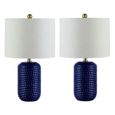 two blue lamps with white shades on them