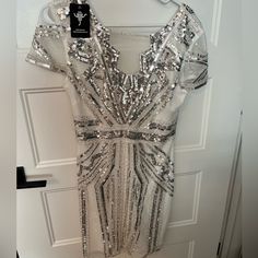 Nwt Silver And White Sequin Gatsby Dress White Sequin Mini Dress For Formal Occasions, Formal White Mini Dress With Sequins, Formal White Sequined Mini Dress, White Knee-length Party Mini Dress, White V-neck Dress For Party Season, White Mini Dress For Party Season, White V-neck Mini Dress For Party Season, Formal White Mini Dress For Party Season, White Sequined V-neck Mini Dress