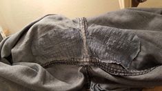 an old pair of jeans with holes in them