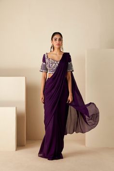 This ensemble features a precisely hand-embroidered blouse adorned with intricate handwork details, perfectly complemented by a pre-draped saree for effortless sophistication. Crafted from luxurious georgette crepe, it offers both comfort and style, with padded support and a fully lined finish ensuring a flawless drape. The convenient back hook opening adds ease of wear, while the cut work neckline adds an extra touch of glamour. Elevate your ethnic wardrobe with this exquisite ensemble, ... Bridal Shower Cocktails, Draped Saree, Couple Wedding Dress, Drape Saree, Lehenga Saree, Floral Crown, Cut Work, Embroidered Blouse, Skirt Length