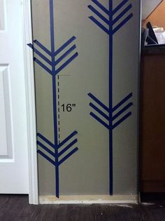 a door with blue arrows painted on the side and measurements for each piece of furniture