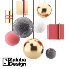 a group of balls hanging from strings with the words zaba design on it's side