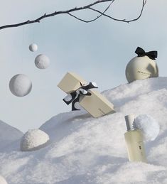 an assortment of perfumes and ornaments in the snow