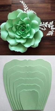 paper flowers are cut out and placed on top of each other to make a flower arrangement