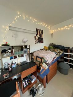 a bed room with a neatly made bed and desk