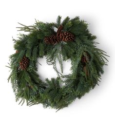 a christmas wreath with pine cones and greenery