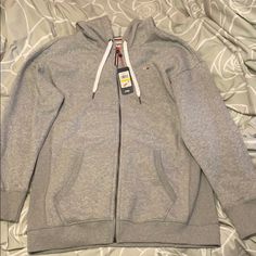 Tommy Hilfiger Grey Hoodie. Size M. The Sweater Is Brand And Fits Oversized. Accepting Reasonable Offers Tommy Hilfiger Winter Hoodie, Tommy Hilfiger Fall Sweatshirt With Drawstring Hood, Tommy Hilfiger Hoodie For Winter Streetwear, Tommy Hilfiger Winter Hoodie For Streetwear, Tommy Hilfiger Sporty Hooded Sweatshirt, Tommy Hilfiger Sporty Hoodie For Fall, Tommy Hilfiger Sporty Hoodie For Winter, Sporty Hooded Tommy Hilfiger Sweatshirt, Tommy Hilfiger Long Sleeve Hoodie For Winter