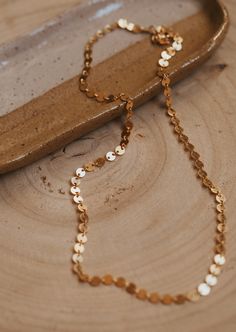 Because who wouldn’t want to wear confetti?! This chain catches the light with every subtle movement. Available in 16" or 18" lengths. Available in 14kt Gold Fill + Sterling Silver. Jess B layers it with our Herra Chain. Handmade in Eau Claire, WI. Our jewelry is handmade so each piece will be unique and may vary slightly from what is pictured. Jewelry Wishlist, Adornment Jewelry, Everyday Wear Jewelry, Permanent Jewelry, Necklace Collection, Layered Chains, Jewelry Photography, Jewelry Cleaner, Unique Styles