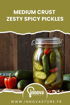 a jar filled with pickles sitting on top of a table next to other vegetables