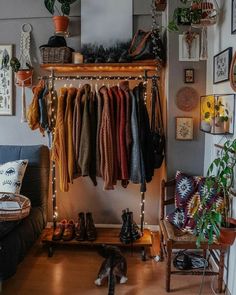 a living room filled with lots of clothes and shoes