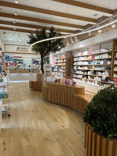 the inside of a pharmacy store with wooden shelves and planters on either side of the counter