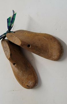 two wooden shoes are tied to a string