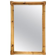 a mirror that is made out of bamboo