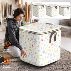 a woman kneeling on the floor next to a large storage box with four different designs