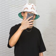 This reversible bucket hat can be worn on both sides, making it easy to match with different outfits. Made of breathable premium fabric, this hat will become your go-to streetwear accessory. * 100% polyester * Fabric weight: 8.1 oz/yd² (275 g/m²)  * Moisture-wicking and breathable fabric * Linen feel material * Reversible * Available in 2 sizes * Blank product components sourced from China Reversible Bucket Hat, Streetwear Accessories, One With Nature, Different Outfits, Bucket Hats, Moisture Wicking, Breathable Fabric, Caps Hats, Bucket Hat