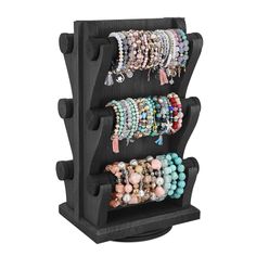 a black rack with bracelets on it