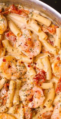 pasta with shrimp and tomato sauce in a pan