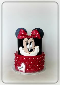 a mickey mouse cake with red and white polka dots