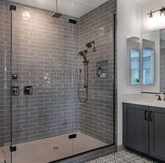 a walk in shower sitting next to a bathroom sink