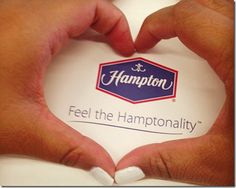 two hands making a heart shape with the words hampton feel the hymphonnality