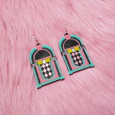 These rad af Jukebox Earrings are super colorful, and are an awesome statement piece for any outfit! They were designed digitally by BC, then laser cut with many colors of 1/8 of an inch thick acrylic. The pendants were attached to a lightweight layer of 1/16" black acrylic for extra durability while remaining lightweight.Each pendant was then added securely to a silver hypoallergenic earring hook.From top of earring post to bottom of pendant- 3.25 inches tall.These earrings can be made as hooks Retro Dangle Earrings Gift, Retro Dangle Earrings For Gift, Retro Multicolor Earrings With Ear Wire, Retro Dangle Earrings, Retro Dangle Jewelry, Retro Rectangular Earrings For Gift, Retro Pink Earrings For Party, Funky Pink Earrings For Gift, Retro Pink Party Earrings