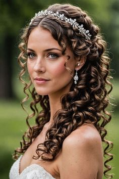 a woman with long curly hair wearing a tiara