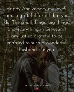 a man and woman standing next to each other in front of trees with the words happy anniversary