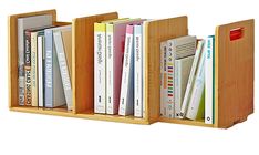 the bookshelf is made out of wood and holds several different types of books