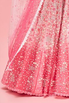 Editor's Note Rose Pink Nishat Bagh Embroidered Ombré Lehenga With Blouse And Dupatta Color: Pink Fabric: Lehenga & Blouse: Organza; Lining: Shantung; Dupatta: Tulle Care: Dry Clean Only About the Designer Nachiket Barve is an award-winning Fashion and Costume designer based in Mumbai, India. He is known for his eponymous label that celebrates Indian tradition with a contemporary and global outlook. Floral Embroidered Organza Lehenga For Navratri, Navratri Organza Lehenga With Floral Embroidery, Pink Organza Lehenga For Navratri, Floral Embroidered Lehenga For Eid Party, Pink Organza Choli With Dori Work, Eid Party Choli With Floral Embroidery, Pink Floral Embroidered Sharara With Traditional Drape, Pink Sharara With Floral Embroidery And Traditional Drape, Pink Sharara With Floral Embroidery