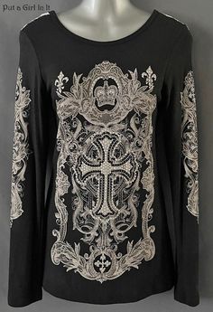 New Womens Vocal Apparel embellished crystal black cross lace contrast long sleeve shirt This incredibly unique Vocal shirt is just stunning. Gorgeous black with embellished stones on front AND down both sleeves. Pretty white lace contrast on back. Light soft material. SO MUCH BLING Just GORGEOUS Made in USA by Vocal Apparel I have been selling Vocal clothing for 15 YEARS now and just LOVE this brand! Please see measurements 62% Polyester - 35% Rayon - 3% Spandex - Has some stretch Measured with Gothic Crew Neck Tops For Party, Fitted Long Sleeve Blouse With Rhinestones, Black Stretch Embellished Tops, Stretch Embellished Black Tops, Elegant Long Sleeve Tops With Rhinestones, Black Long Sleeve Tops With Rhinestones, Back Light, Black Cross, Graphic Tees Women