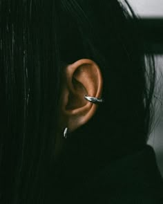 a person with ear piercings on their ears