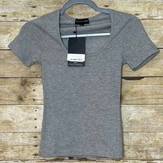 Prettylittlething Basic Scoop Neck T Shirt. Grey. Short Sleeve. Nwt. No Flaws. Machine Washable. Made Of 50% Polyester, 45% Cotton, And 5% Elastane. Armpit To Armpit: 13" Length: 21" Basic Fitted Short Sleeve Top With Scoop Neck, Trendy Fitted Short Sleeve Top With Scoop Neck, Trendy Solid Color Short Sleeve Top With Scoop Neck, Trendy Solid Color Scoop Neck Short Sleeve Top, Trendy Solid Color Short Sleeve Scoop Neck Top, Fitted Short Sleeve Scoop Neck Top, Fitted Scoop Neck Short Sleeve Top, Trendy Scoop Neck T-shirt For Spring, Trendy Cotton Short Sleeve Top With Scoop Neck