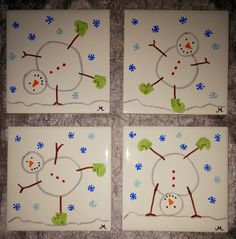 four snowmen are painted on white tiles